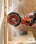 Heavy Duty Angle Grinder Water Attachment With Brass Adjustable Nozzle And Flexible Hose For Dust Suppression and Slick Wet Cutting Tile Work That Runs Nice And No Sweat in action cutting through a wall.