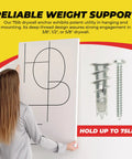 Woman holding drywall panel with zinc self drilling drywall anchor kit with screws for hollow walls visible beside.