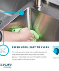 Close view of undermount bar sink being cleaned, showcasing modern design. "Undermount Bar Sink Built Tough In 18 Gauge Stainless Steel 13.5 Inch By 18.5 Inch By 9 Inch Single Bowl Type 304 Durability Quiet Rinse Friendly Design Real Workhorse For Home Kitchens And Prep Areas."