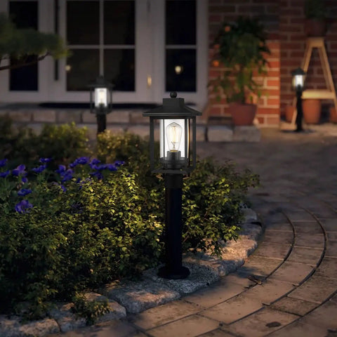 Boss Black Outdoor Post Light With Clear Glass Shade for garden pathway lighting at night with glowing lanterns and plants