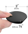 Slick Black Rubber Furniture Levelers 2 Inch Adjustable Shims showing a hand holding a 2 inch shim for stabilizing furniture