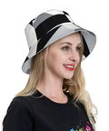 Fire Black And White Piano Grid Print Bucket Hat With Double Sided Reflective Trim unisex hat worn by a woman, side view.