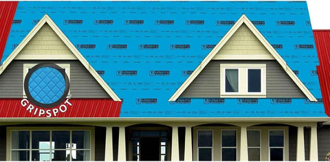 Heavy Duty Self Adhering Roof Underlayment 41 Mil Ice And Water Shield laid on a house roof with red panels.