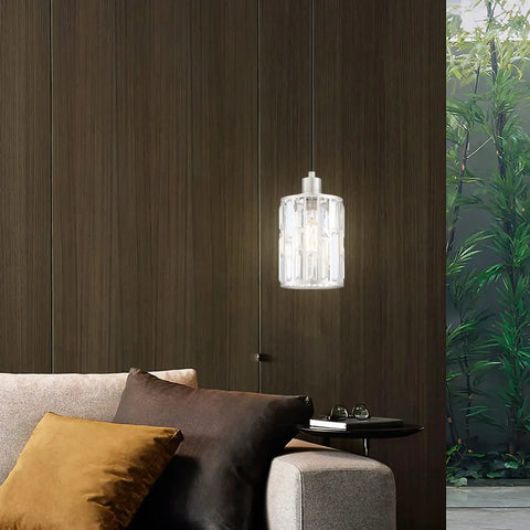 Three Pack Crystal Hanging Pendant Lights 5.5 Inch With Brushed Nickel Finish For Kitchen Island Bar And Dining Room Modern Sleek Pendant Fixture With Crystal Metal Shade For Corridor Living Room Over Sink hanging over a modern living room sofa.