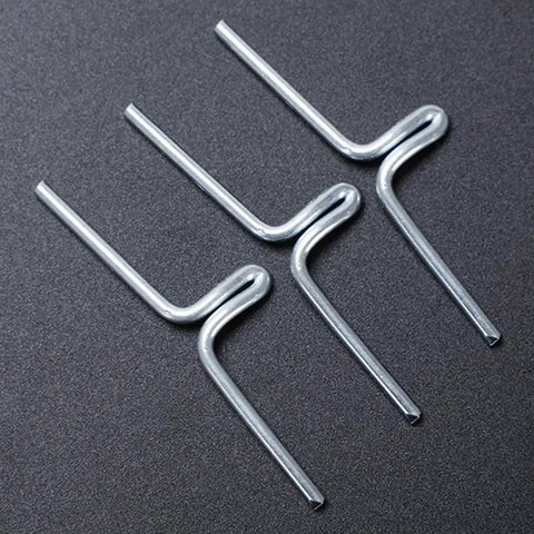 Three alloy clips from 60 Pack Must Have Lawn Chair Webbing Straps Clips Kit For Patio Chairs And Sofa Frames on black surface