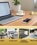 20A Tamper-Resistant Receptacle Floor Box with Flip Lid and Brass Cover in office workspace with laptop and smartphone charging