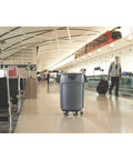Heavy Duty 44 Gallon Gray Trash Can With Dome Top And Snap Lock Industrial Workhorse Waste Bin Built Rock Solid Stackable Commercial Storage Container Made In Usa in airport setting.