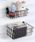 Two black metal slatwall baskets holding items; part of Four Piece Large Slatwall Baskets Set Ventilated Metal Pegboard Baskets for PVC Slatwall Panels Hangin Storage for Garage Organization and Display Black