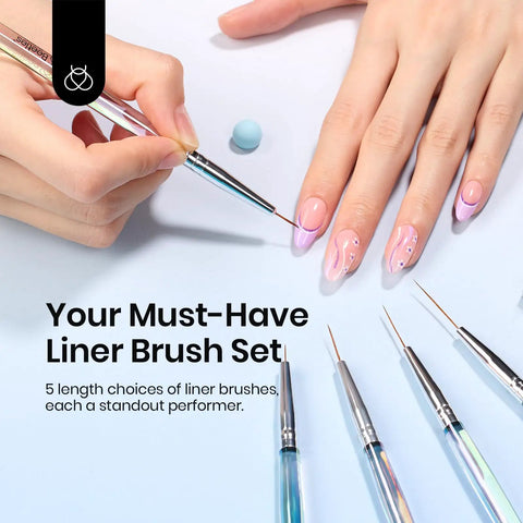 Applying polish with 5 Pcs Nail Art Liner Brush Set With Metal Handles For Long Lines And Fine Details In 7mm 11mm 15mm 20mm And 25mm Sizes.