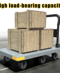 Foldable Heavy Duty Platform Cart With 1764 Pound Capacity carrying wooden crates on six wheels, gray with reinforced base.