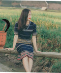 Woman sitting on fence with basket and Durable Manganese Steel Scythe Long Hand Hoe For Garden Weeding Heavy Duty Yard Work Hand Weeder Tool
