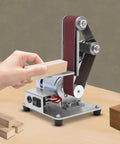 Big Gun Mini Belt Sander 110V Electric Grinder Polisher for Stripping Rust, sharpening wood, with abrasives in use.