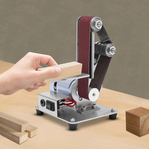 Big Gun Mini Belt Sander 110V Electric Grinder Polisher for Stripping Rust, sharpening wood, with abrasives in use.