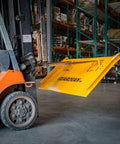 Built Tough Steel Dock Board 60 X 72 Inch 16000 Lb Rated Capacity Forklift Transfer Plate on a forklift in a warehouse.
