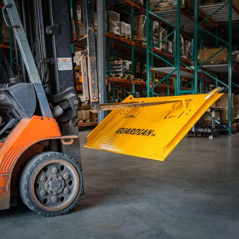 Built Tough Steel Dock Board 60 X 72 Inch 16000 Lb Rated Capacity Forklift Transfer Plate on a forklift in a warehouse.