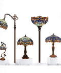 Tiffany style dragonfly blue stained glass table lamp displays intricate design with antique green bronze base in various light formats.