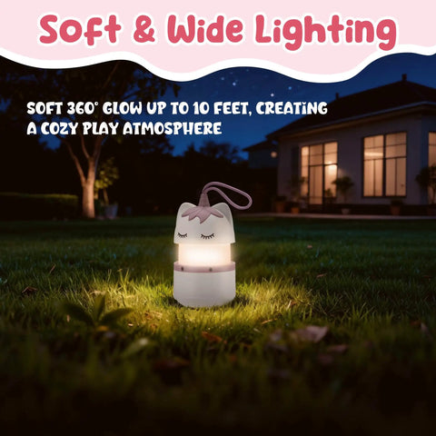 Two Pack Unicorn Themed Kids Camping Lanterns With RGB Multicolor Lights Battery Powered with lanyard in garden at night