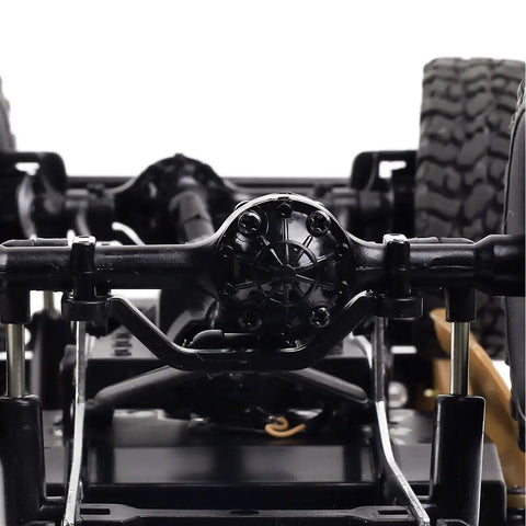 Underside view of RC Rock Crawler WPL C24 RTR 1/16 Scale Pickup Truck with 4x4 suspension and high traction tires, off-road ready.