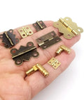 Twelve Pack Mini Heavy Duty Cabinet Door Hinges With Screws Golden Finish 5x19mm Durable Mounting Hardware For Kitchen Cabinets Pantry Doors And DIY Projects, assorted hinges in hand