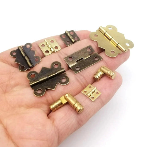 Twelve Pack Mini Heavy Duty Cabinet Door Hinges With Screws Golden Finish 5x19mm Durable Mounting Hardware For Kitchen Cabinets Pantry Doors And DIY Projects, assorted hinges in hand