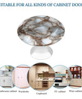 Rock Solid White And Brown Marble Pattern Round Cabinet Knobs With Screws Drawer Pulls And Handles Set Of Two on a clear base.