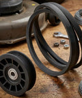 Must Have Idler Pulley And Drive Belt Combo Kit For Stens Z254F And CZ3815 Mowers showing rubber components on a wooden surface.