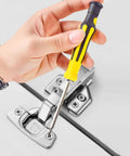 Hand using 6 In 1 Screwdriver Set With Magnetic Precision Bits For Electronics, Glasses, Watches, Phones, And Laptops on a hinge