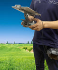 Person holding an FPV Remote Controller 2 Tablet Mount For DJI FPV Drone Fits 4.7 To 12.9 Inch Tablets in a field setting
