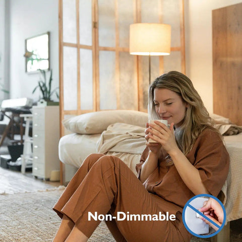 Non-dimmable Enclosed Fixture LED Stick Bulbs 14W, 100W Equivalent in cozy room with woman holding mug