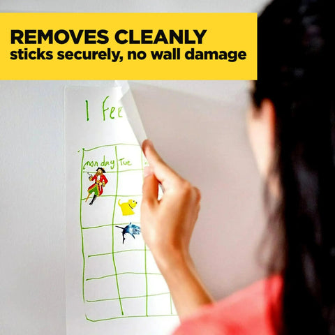 Legit Wall Safe Tape With Smooth Hold Go To Removable Rolls For Hanging Frames And Wall Decor Easy Peasy Peel And Stick Zero Damage Promise Two Mega Refills Inside, removing a calendar from the wall.