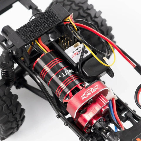 Unity24 Pro 3500Kv 2-In-1 Micro FOC Brushless System installed in Axial SCX24 RC Car, showing motor and ESC combo