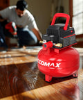 Portable Pancake Air Compressor With A Roomy Three Gallon Oil Free Tank And Heavy Duty 110 Psi Rating Shows Up Fully Loaded With An 11 Piece Accessory Kit For Quick Workshop Setups And Weekend Power Tool Hookups on wooden floor.