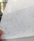 Close-up of Cutting Fluid Filter Paper for industrial oil filtration, emulsion filter paper made from mixed fiber, 50 cm by 100 m roll.