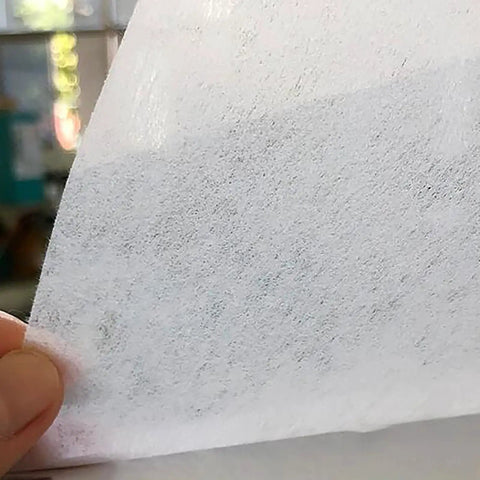 Heavy Duty Cutting Fluid Filter Paper Roll Straight Up Tough For Grinders And Machine Shops Top Shelf Mixed Fiber Oil Filtration 100Cm By 100M visible close-up of white filtration roll material.