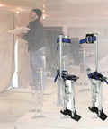 Pro Grade Aluminum Drywall Stilts 15 To 23 Inch Adjustable Lifts For Taping And Painting, in use indoors by a painter.