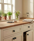 Matte Black Mushroom Cabinet Knobs Pull Handles for kitchen cabinets in a bright kitchen setting
