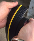 Hands holding Ultimate Garage Door Threshold Seal Kit With Adhesive And Weather Stripping 12.5 Feet Weatherproof Barrier