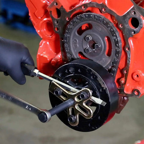 Mechanic using Harmonic Balancer Puller Kit For GM 3300 And 3800 V6 Engines Removes Balancers Dampers And Pulleys Includes Metric And SAE Bolts DIY Or Pro Grade Tool on engine