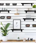 Garage wall with 12 Pack Slatwall Bins With Hooks Set Plastic Slatwall Organizer Bins And Metal Slatwall Hooks installed.