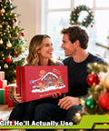 Couple holding 17 In 1 Survival Kit For Men And Outdoor Adventurers gift box in front of Christmas tree.