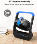 5 Inch Battery Powered Desk Fan for Camping and Travel with D Cell Batteries, showing 180 degree rotation feature on wooden table