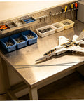 10 Piece Carbon Fiber Rod Set For Model Aircraft And Kites Lightweight And Easy To Install on a workbench with tools