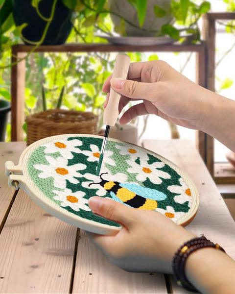 Person using Punch Needle Kits For Adults And Beginner Friendly Diy Embroidery Set With 7.8 Inch Hoop Pattern Fabric Punch Needle Instructions Needle Threading Tool And Yarn Assortment on floral design