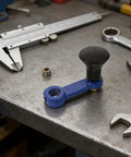 Heavy Duty Rotary Tiller Handle Attachment Two Pack With Manual Hand Crank Lift for precision adjustment on metal workbench