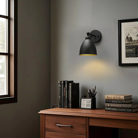 Industrial Hardwire Wall Sconce With Old School Farmhouse Vibe installed above desk, black finish, right-angled metal lampshade