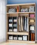 12-Cube Black Storage Organizer Shelf System For Bedroom, Office, And Living Room in a wooden closet filled with clothes and boxes