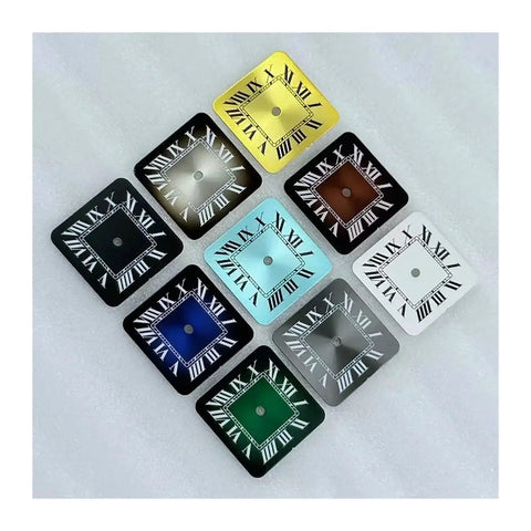 Colorful square watch dials with Roman numerals arranged on a white surface.