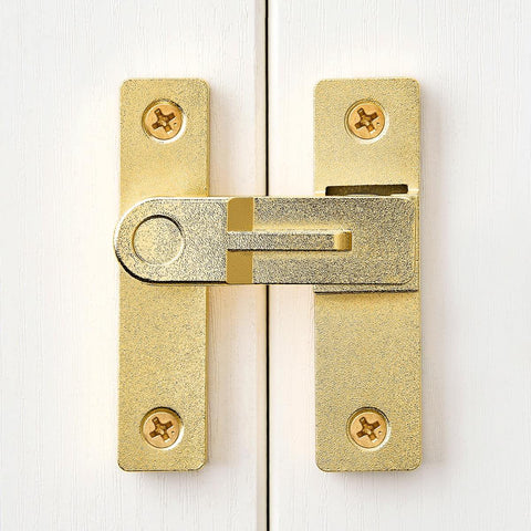 Front view of 180 Degree Flip Barn Door Lock in Gold mounted on a white door showcasing heavy-duty gate latch design.