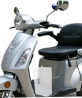 Tough As Nails Weatherproof Socket Box For E Bike Charger Shield mounted on electric scooter, showcasing white plastic housing.