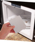 Person holding 10 Pack High Temperature Mica Sheets For Microwave Ovens Heat Resistant Waveguide Cover And Insulation Shield
